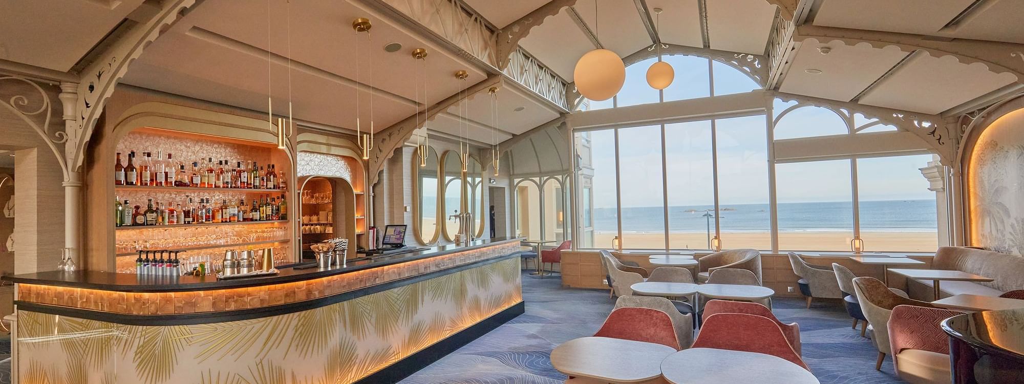 Dining table arrangements in La Passerelle Bar with a Sea view at Le Grand Hôtel des Thermes
