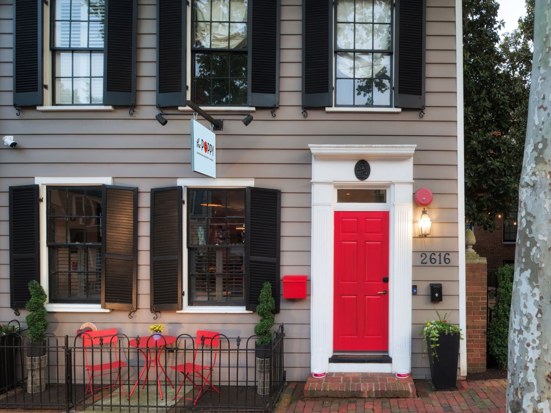 Front Exterior of The Poppy Georgetown Guesthouse and Gardens in Georgetown Washington DC owned and managed by TBC Hotels