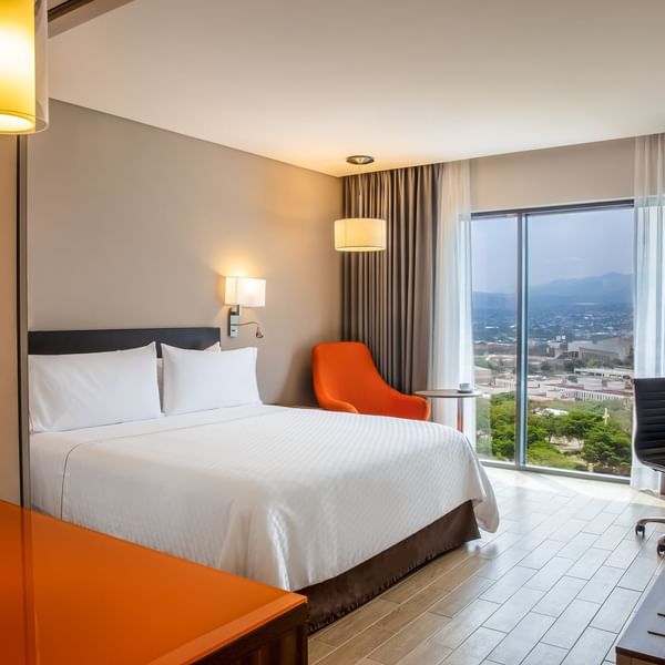 King bed in Superior Room with view at Fiesta Inn