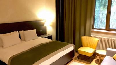 Bed with a window in King Room at Ana Hotels Bradul