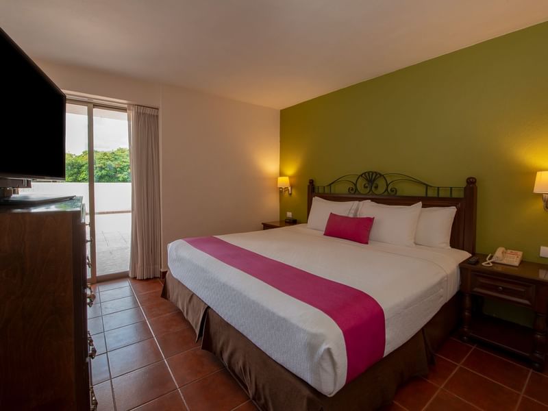 Comfy king bed in Presidential Suite at Gamma Hotels