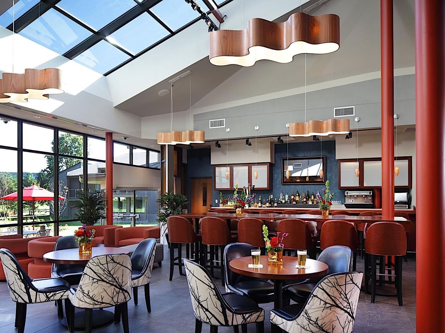 Modern bar with warm decor and comfortable seating at C Bar, Aramark Chauncey, Princeton.