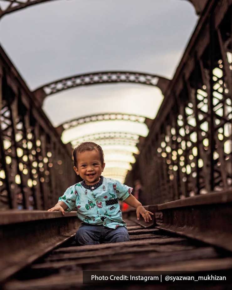 A baby smiled for the camera on the Ipoh Victoria Bridge - Lexis Suites Penang 