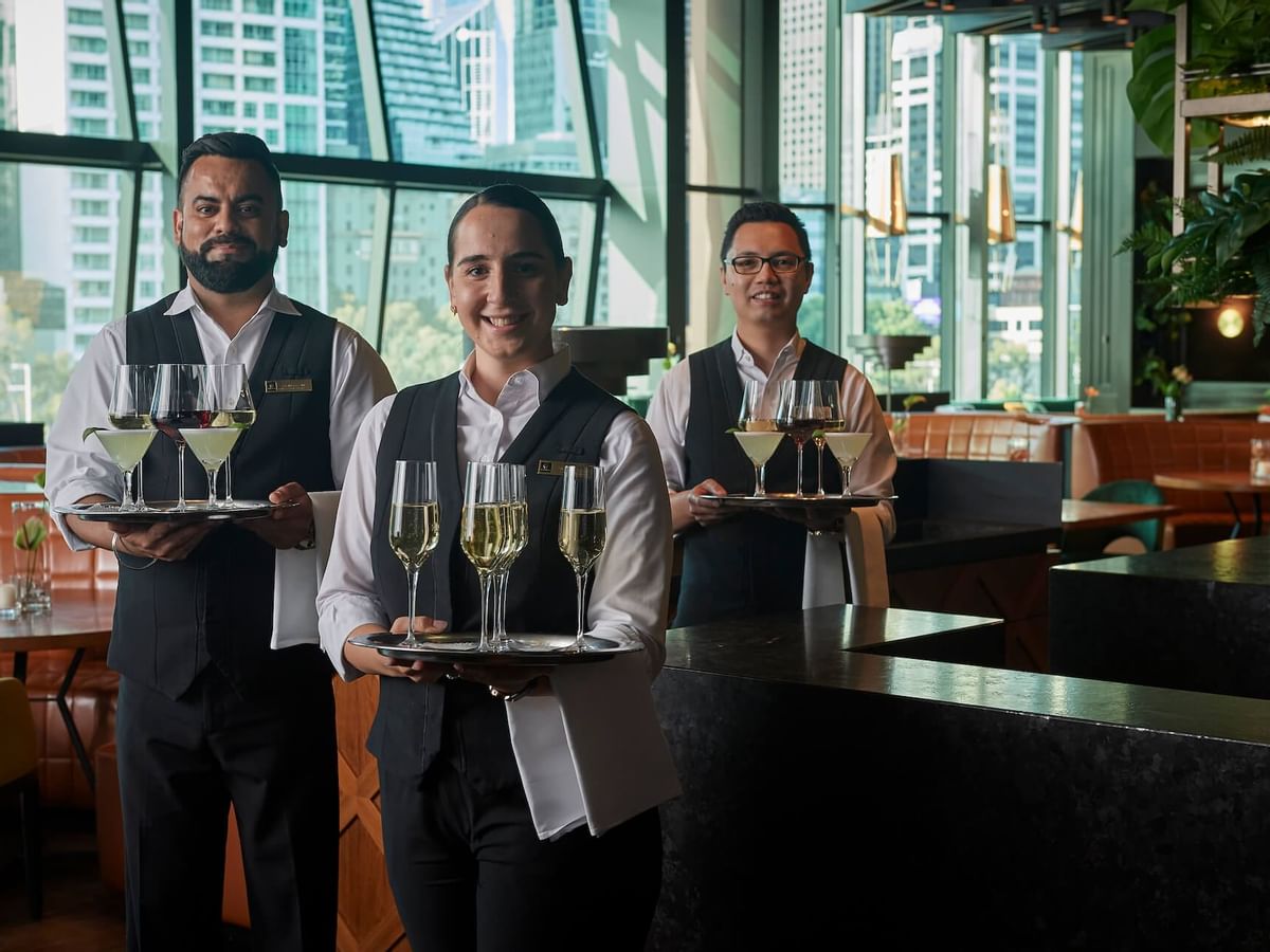Waiters holding wine trays, Evergreen at Crown Hotel Melbourne