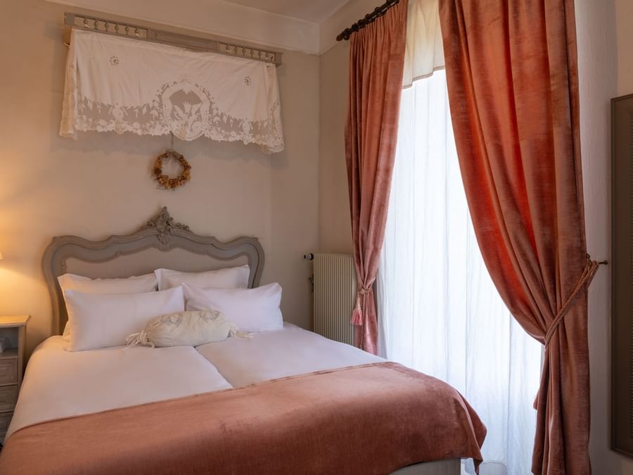 Suite bedroom in Domaine de Beaupre at The Originals Hotel