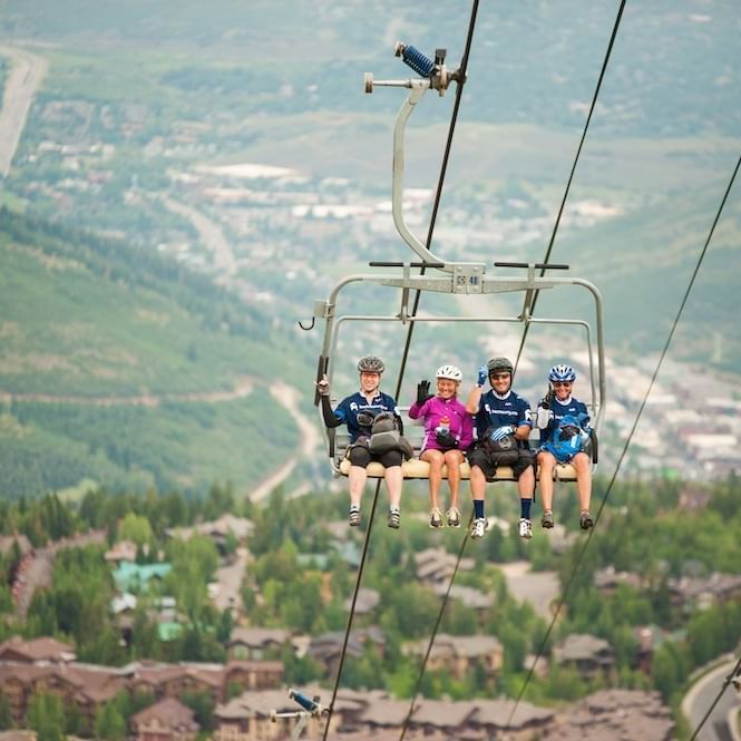 A group of friends enjoying on a Chairlift near the Stein Lodge