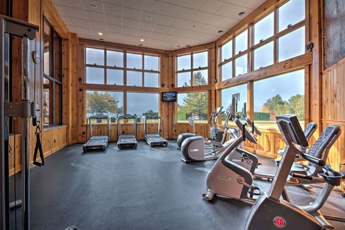 The spacious fitness center at the Lake Placid Club Grandview features cardio equipment and floor-to-ceiling windows