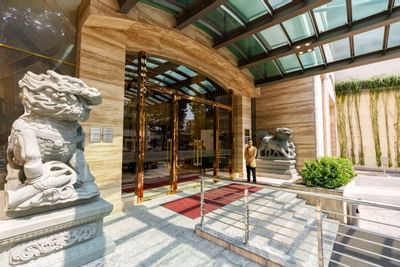 Sherwood Suites Saigon's Entrance with two stone guardian lion