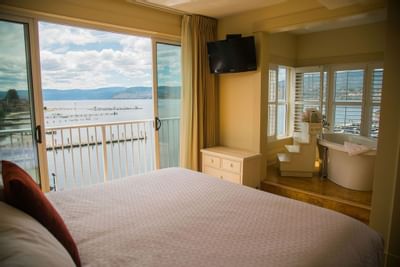 Hotel room with one bed and lake view.