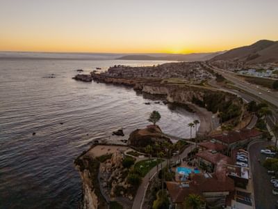 Aerial view of hotel and ocean in Pismo Beach at sunset 