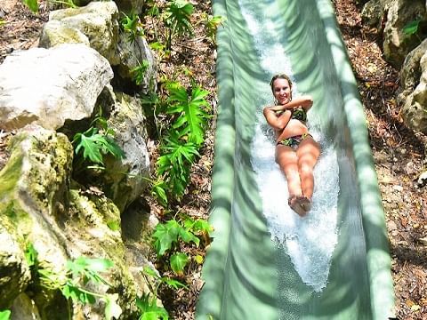 Lady on a waterslide at Xenses near Haven Riviera Cancun