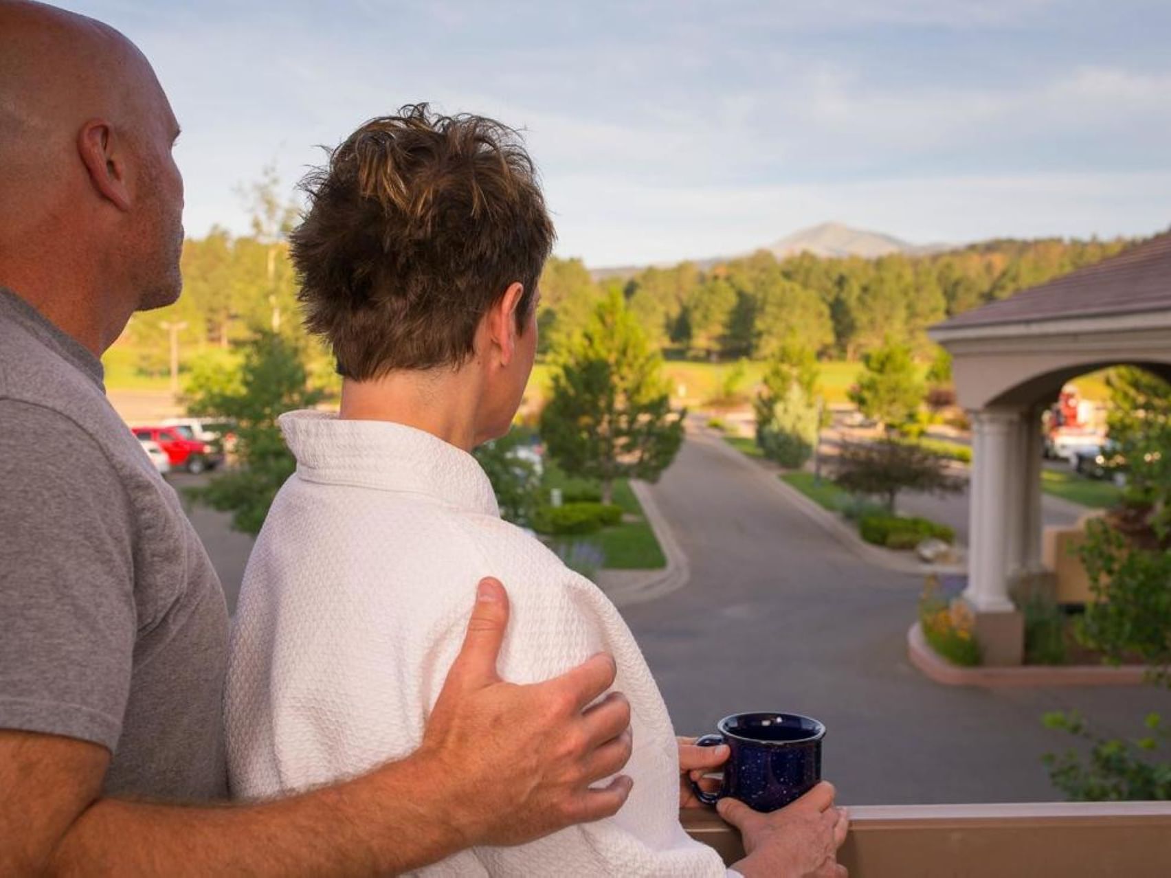 Couple enjoying the view from a balcony at MCM Elegante Ruidoso