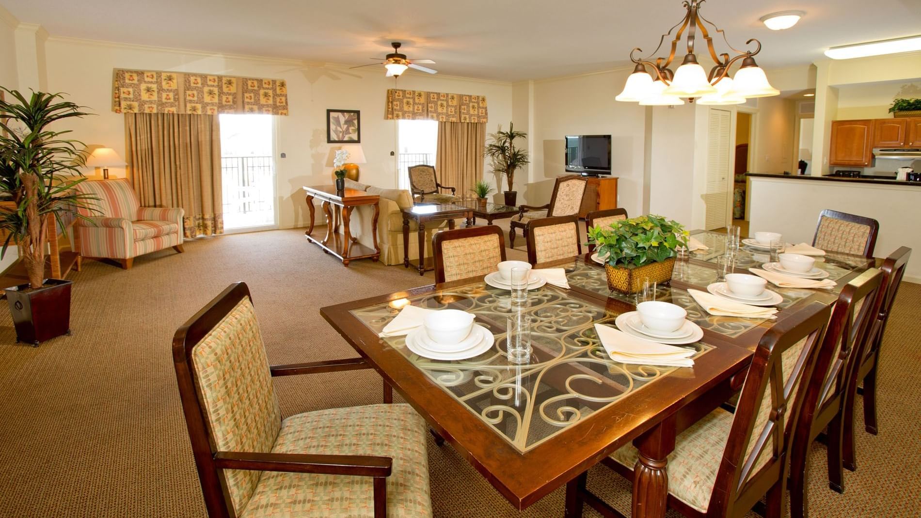 A spacious suite with a dining area, living room, and kitchenette.