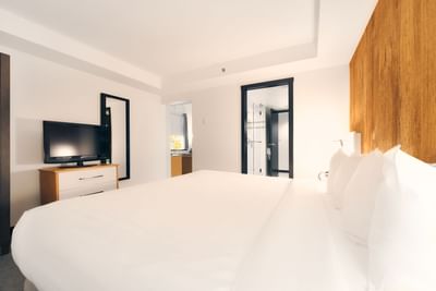 King bed & TV in Executive Suite at Aava Whistler Hotel