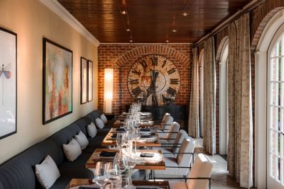 Interior of Vintage Restaurant & Pub with a large rustic clock decor at the inn at Willow grove