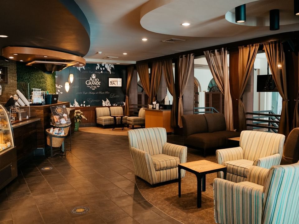Lounge area in El Cafecito with a warm ambience at Las Casitas Village