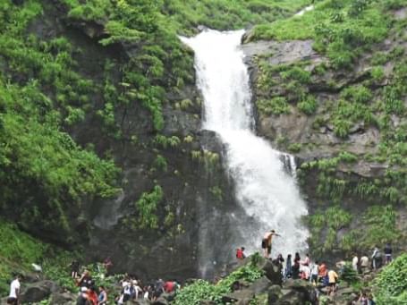 Crowd gathered by the Bhivpuri waterfall near U Hotels