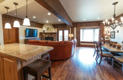 A countertop by a sitting area with fireplace at Stein Lodge