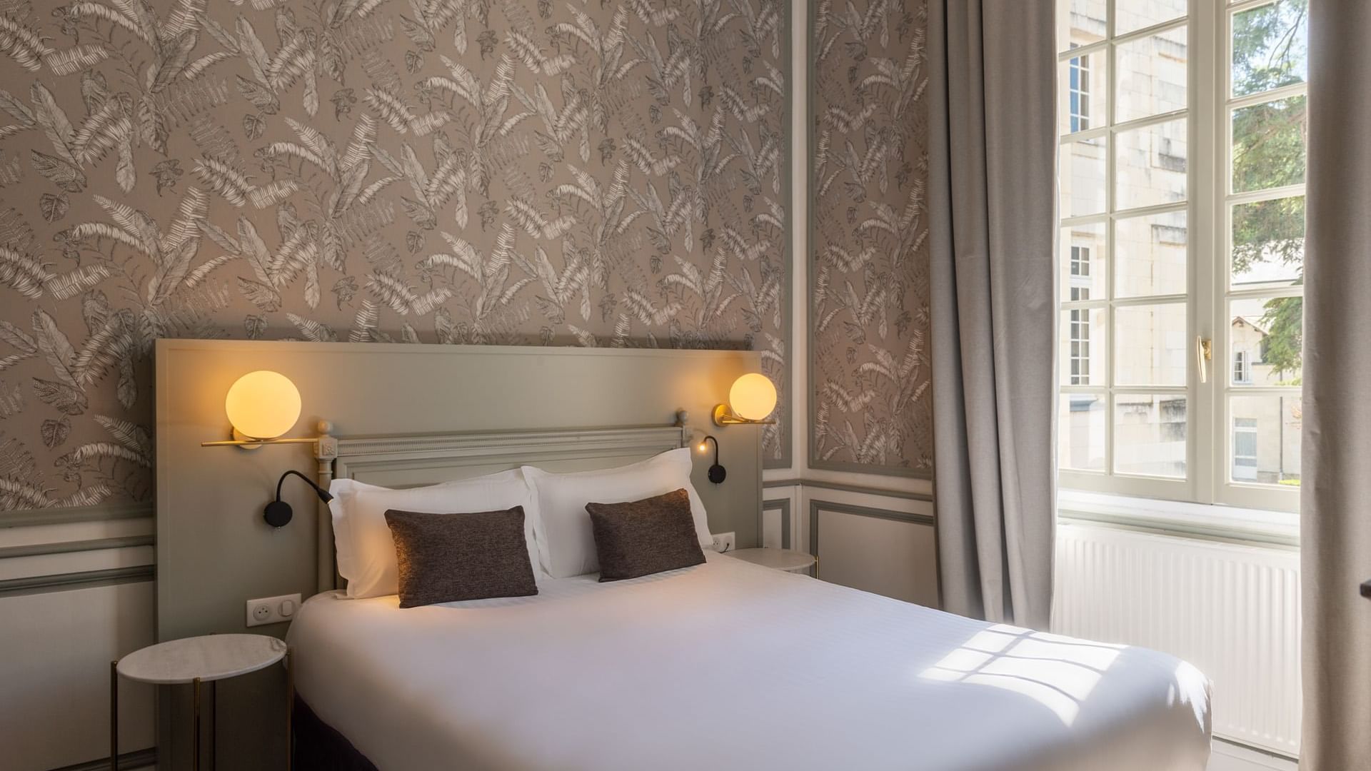 Double bed in chambre classique at The Originals Hotels