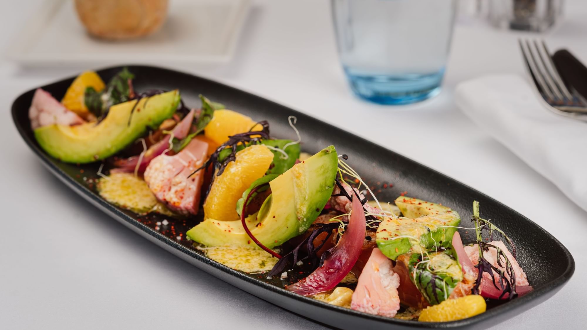 Close-up of Smoked Salmon Tataki salad served in Teseo Restaurant at Warwick Geneva
