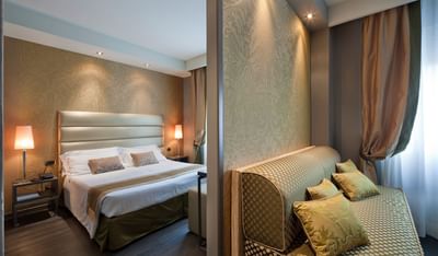 Interior of bedroom in Junior Suite at Hotel Mozart Milan
