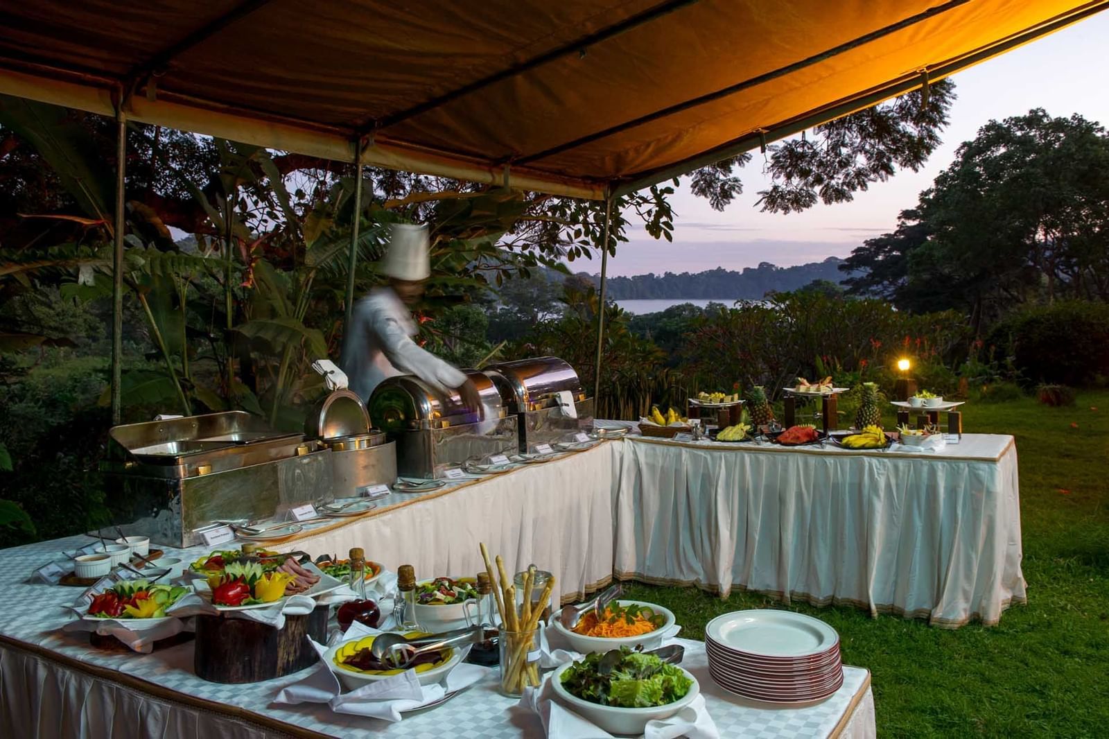 A Buffet setup near the lake at Arusha Serena Hotels