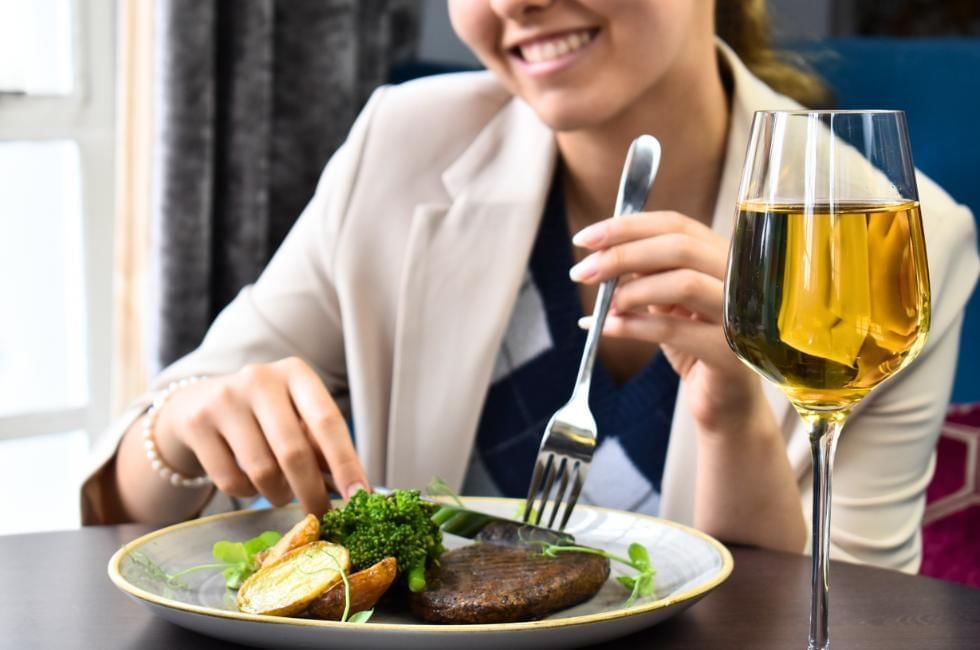 lady dining out tucking into vegan meal at gorse hill in woking