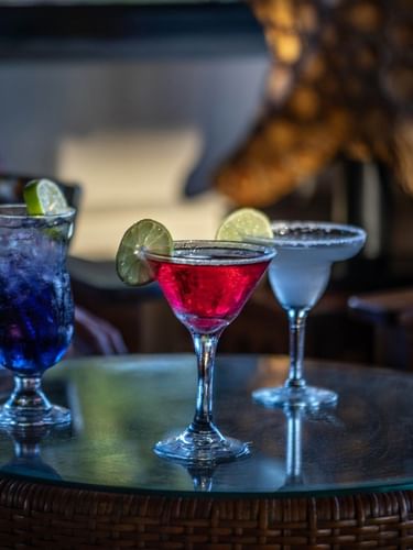 Colorful tropical cocktails served on a woven table in Lobby Bar at warwick le lagon-vanuatu