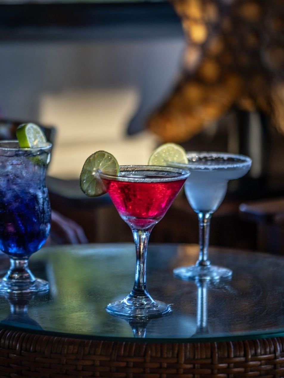 Colorful tropical cocktails served on a woven table in Lobby Bar at warwick le lagon-vanuatu
