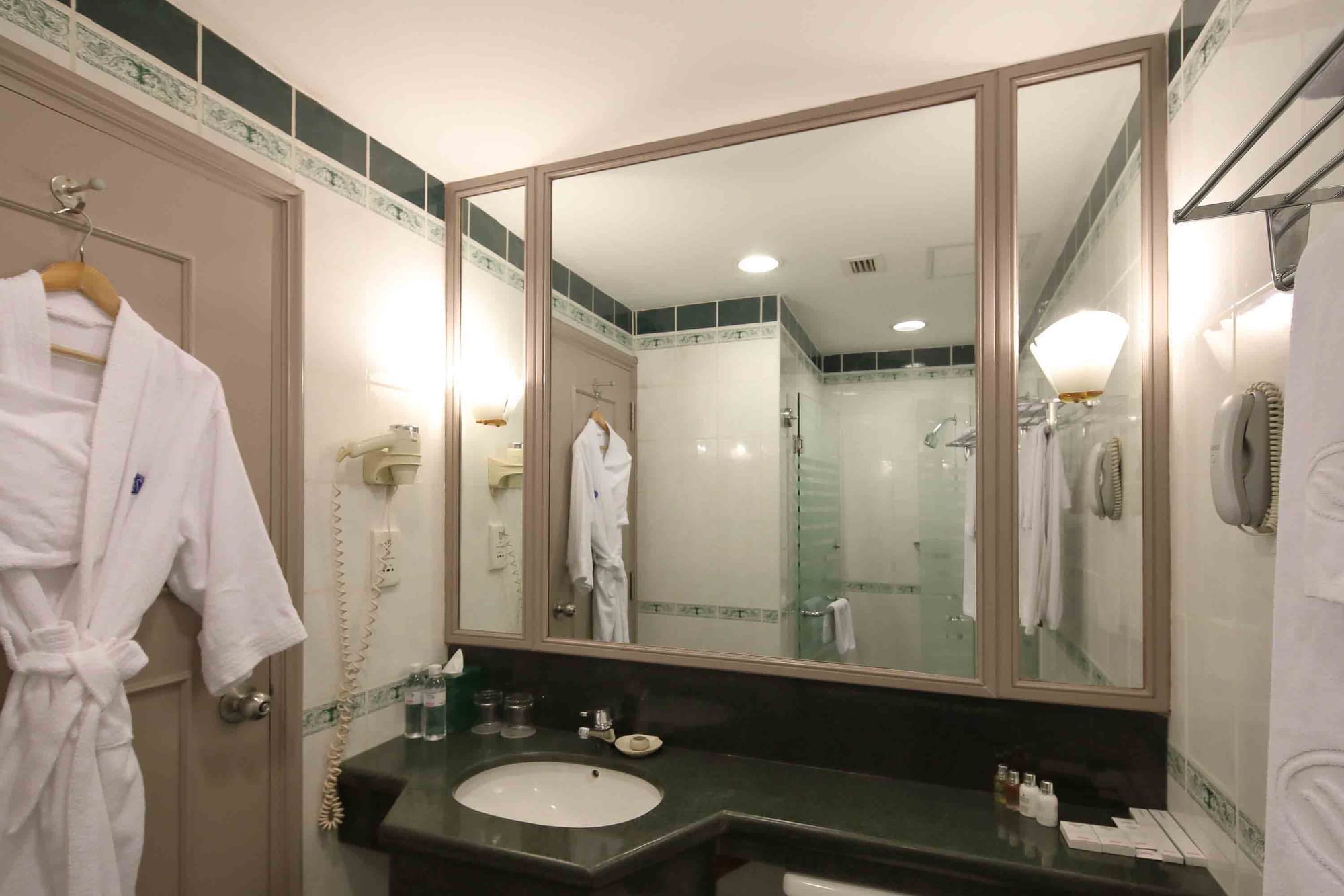 Bathroom with large mirror & vanity in a room at Sunway Hotel Hanoi