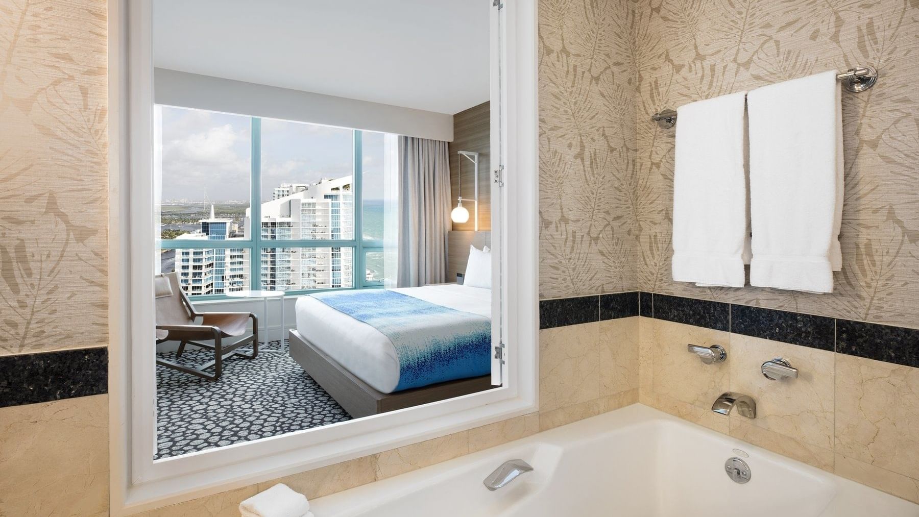 Intracoastal view bathroom with a tub & towels at The Diplomat Resort