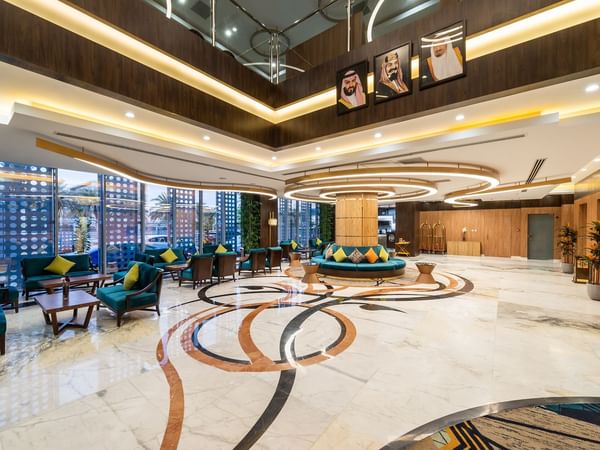 Spacious lobby area with cozy seating at Warwick Riyadh