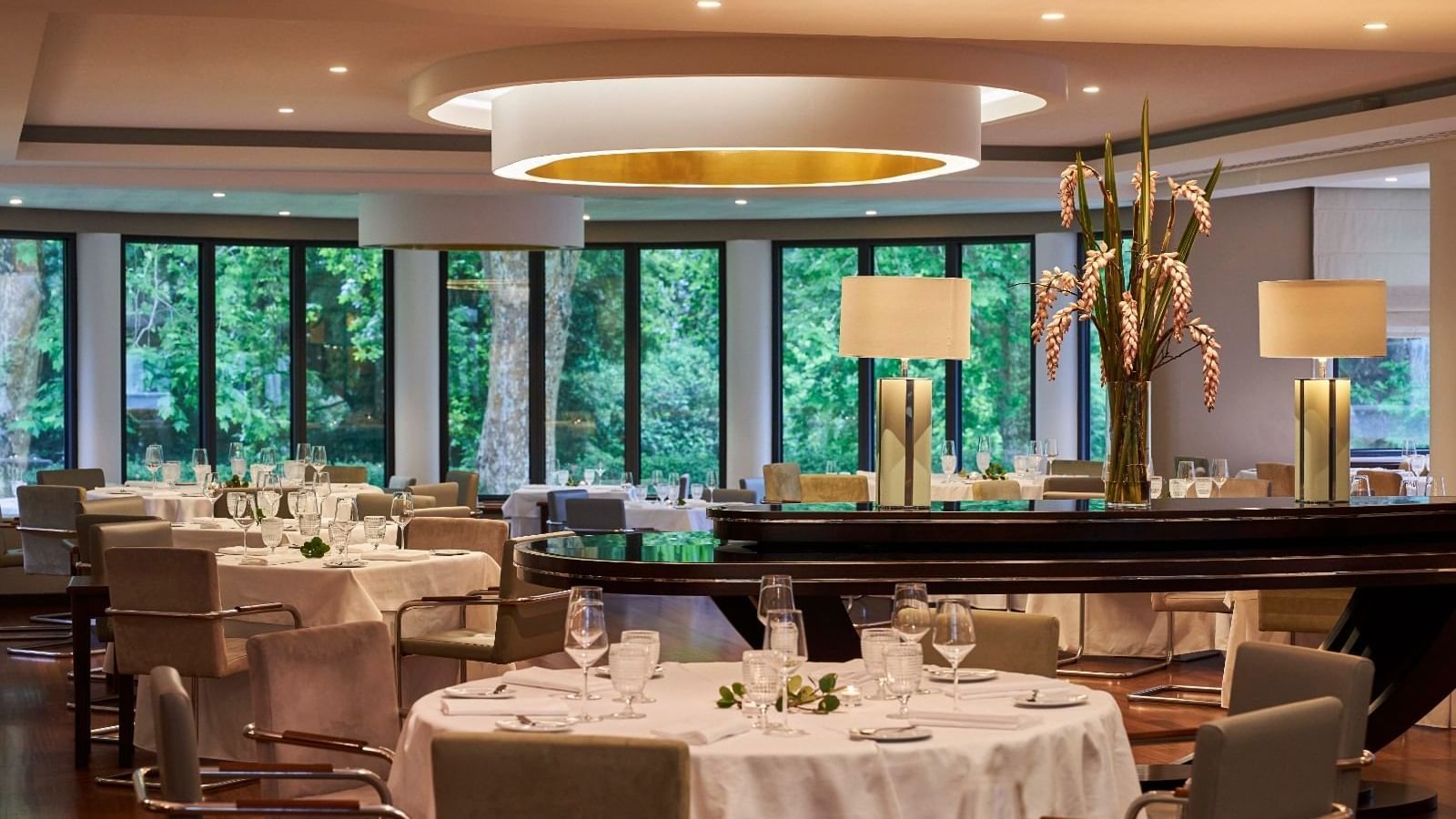 Dining table arrangement in illuminated TN Restaurant at Terra Nostra Garden Hotel