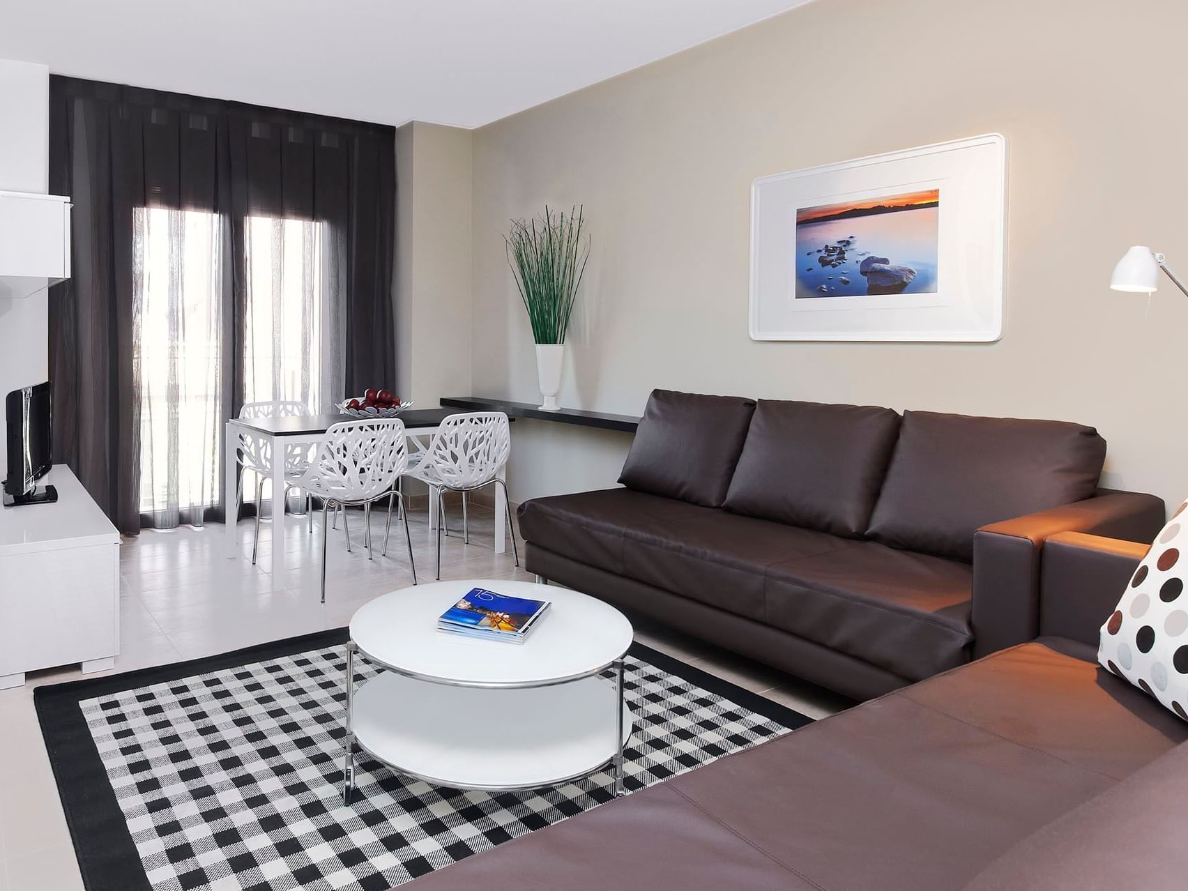 Dining & living area in Deluxe room at Barcelona Apartment