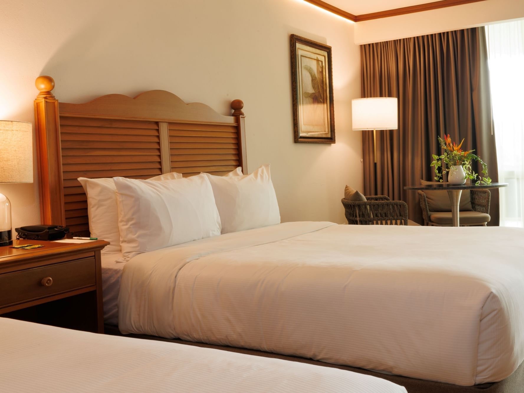Two beds with garden view in a Standard Garden View Room at Gamboa Rainforest Reserve in Gamboa.