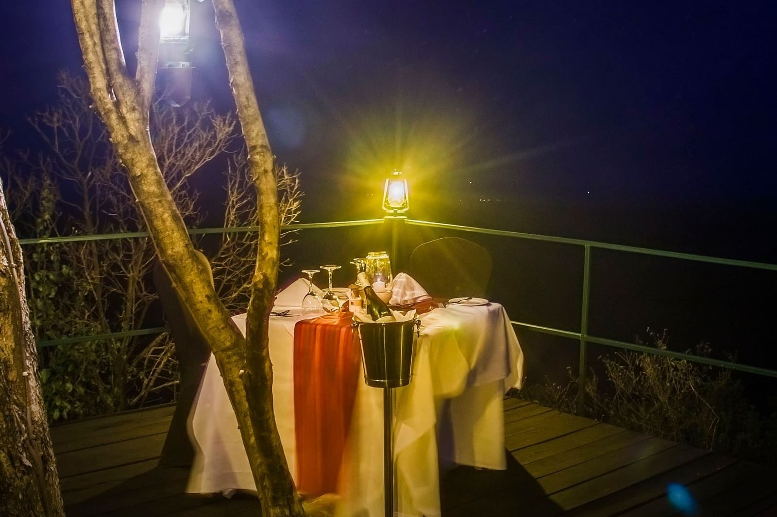 View of a dining table at night in Mara Serena Safari Lodge