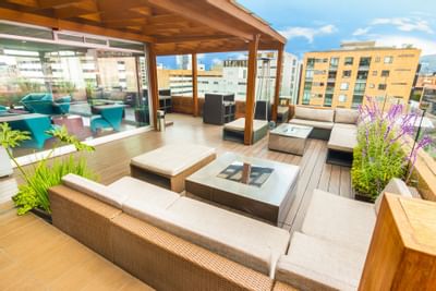 The outdoor chilling area at the rooftop with couches