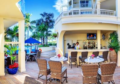 Wide angle of Jojo's Café with dining tables at Windsong Resort On The Reef