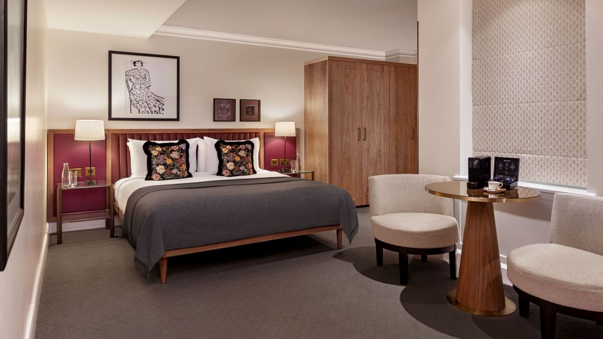 Cozy Collection Superior Room at The May Fair Hotel featuring a double bed with floral pillows and flanked by nightstands