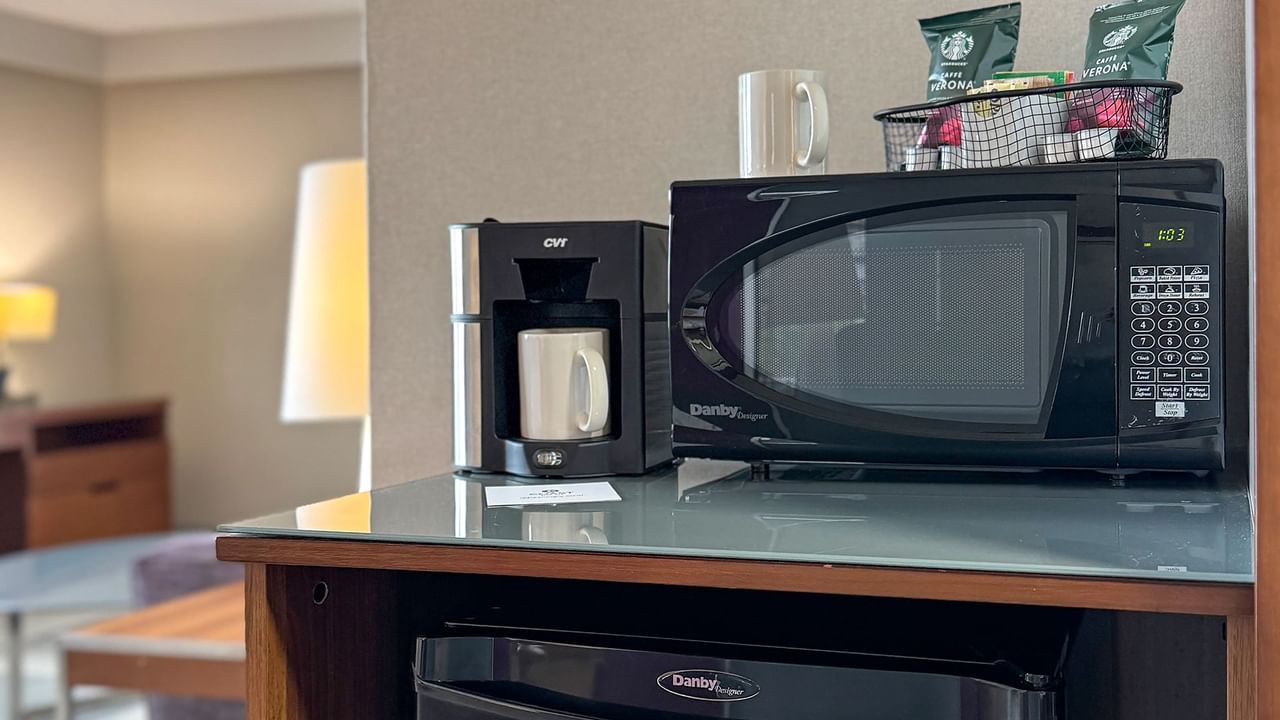A coffee maker, microwave and minifridge