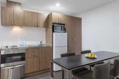 Kitchen & dining in 2-Bedroom Apartment at Nesuto St Martins