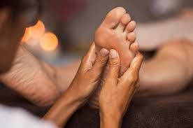 person massaging feet
