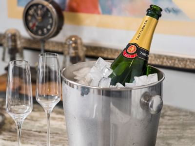 champagne bottle in bucket of ice