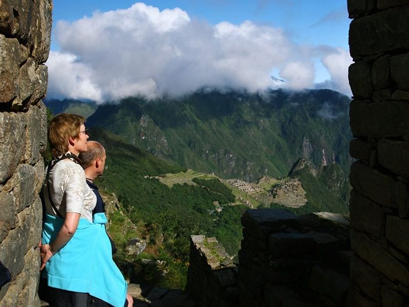 A couple admiring the view in The Sun Gate near Hotel Sumaq