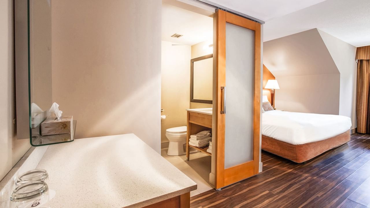 Hotel guest room with a queen bed