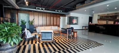 Lobby area with comfy chairs, indoor plants and sofas at D Sabana Hotel, 5 star Hotels in San Jose Costa Rica