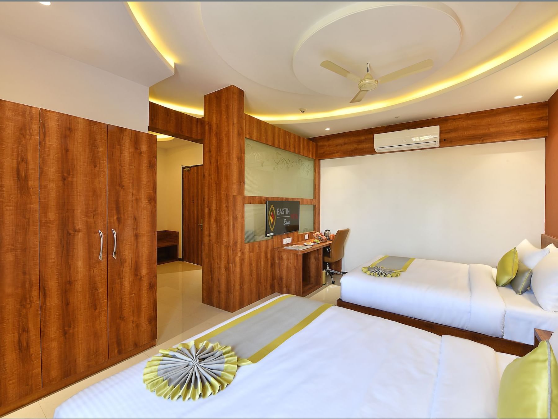 Two cozy beds, cupboards & workspace in Junior Suite Family at Eastin Easy Vita