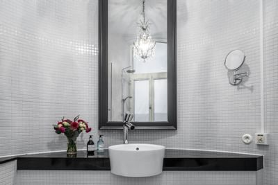 Bathroom vanity area in Deluxe Room at The Sparrow Hotel