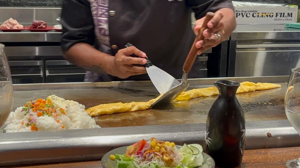 Chef cooking teppanyaki style meal at Warwick Fiji Resort and Spa in Korolevu.