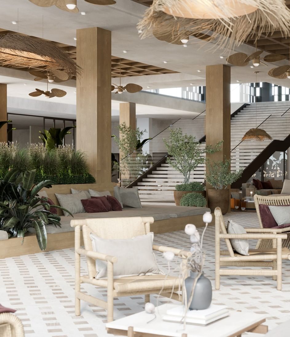 Cozy and stylish lobby lounge at A'ila Resorts, with a natural color palette and wicker furniture